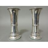 A pair of hallmarked silver vases.