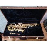 An Artemis alto saxophone with hard case.