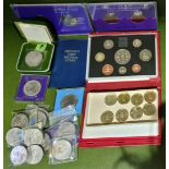 A box of assorted coins including a Royal Mint 1993 proof coin collection, £2 coins, coin sets and