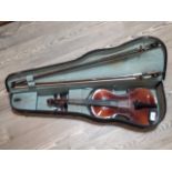 A student violin with hard case and two bows.