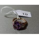 A hallmarked 9ct gold amethyst and colourless stone cluster ring, gross wt. 2.9g, size M.