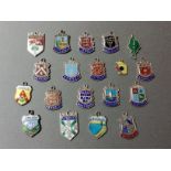 A selection of enameled shields to include Cornwall, Godshill, Jesolo, etc, mainly hallmarked