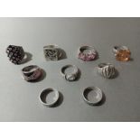 Nine assorted silver rings, various settings.