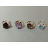 Four assorted hallmarked 9ct gold rings, various stones, gross wt. 17.4g, sizes M to P.