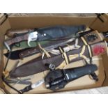 A box of assorted knives including two bowie knives, machetes, diver's knife, Scottish knives etc.