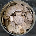 A tin of silver GB coins to include half crowns, florins, sixpences and threepences etc.