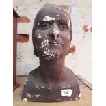 A plaster death mask, depicting a female bust, indistinctly signed "Hodge" ? , height 35cm.