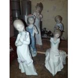 Three Nao and two Lladro figurines.