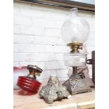 A brass and glass paraffin lamp with etched glass shade and a brass and glass paraffin lamp with