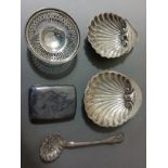 A tray of assorted hallmarked silver to include a sugar sifter spoon, two clam shell butter