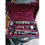 An early 20th century French Buisson nickel mounted rosewood clarinet in associated case.