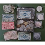 A tin of assorted GB and foreign coins and bank notes.