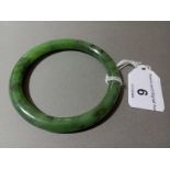 A nephrite jade bangle, diameter 7cm, wt. 33.9g.