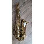 A Trevor James alto saxophone with soft case.