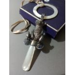 An Edwardian baby rattle in shape of a sitting bear with bells and mother of pearl ring, Birmingham,