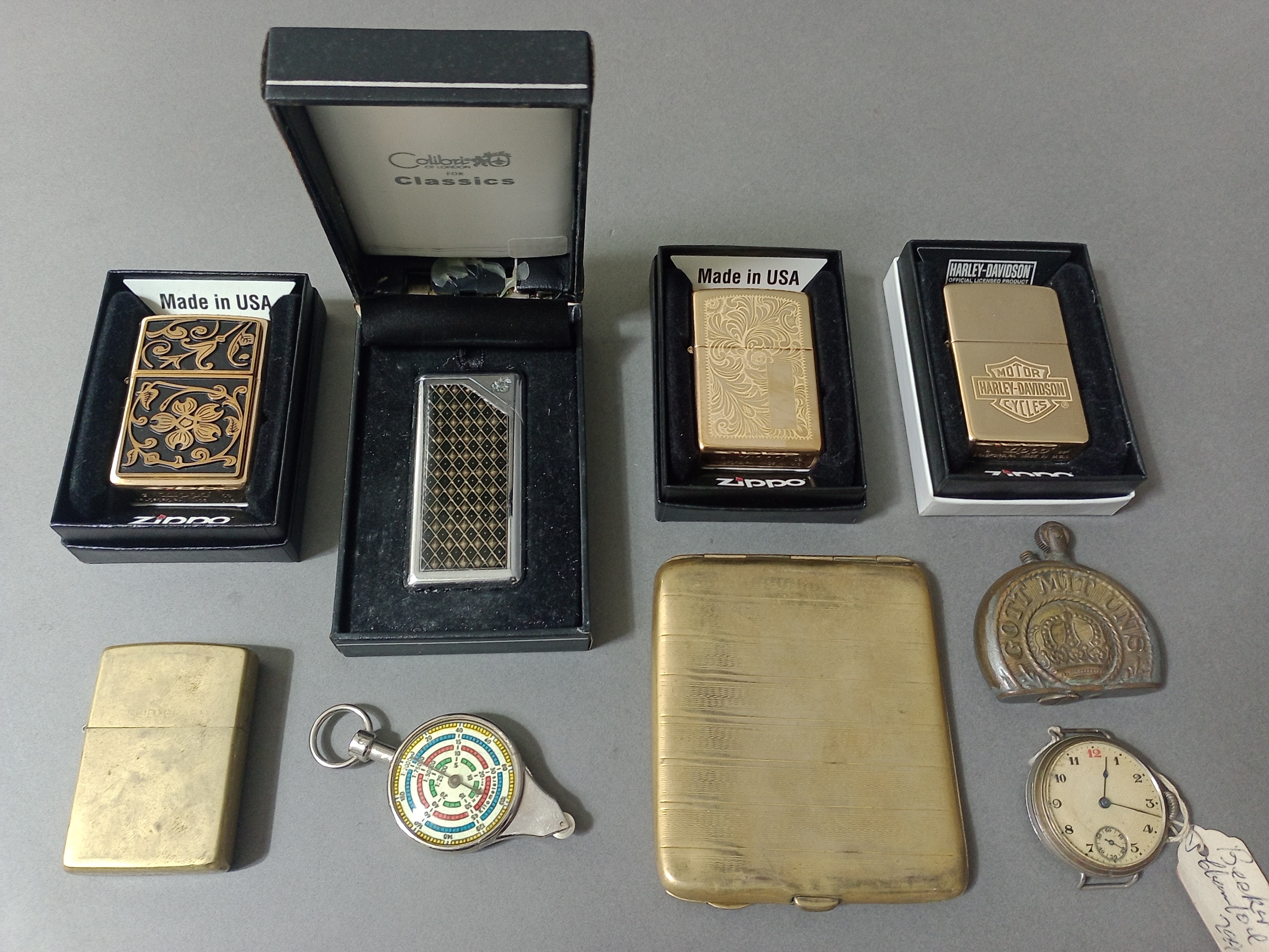 A collection of vintage and modern lighters to include Zippo, Harley Davidson, Colibri, a WW1 trench