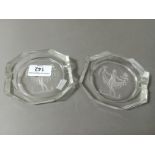 A pair of intaglio glass ashtrays in the manner of Baccarat.