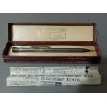 A hallmarked silver propelling pencil, Birmingham, E Co, 1939, with associated box.