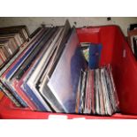 A box of LP records and singles, mostly 1970s and 1980 including Led Zepplin, Deep Purple, AC/DC,