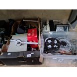 Three boxes containing cine film projectors, film reels and equipment.