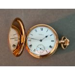 A Waltham gold palted full hunter pocket watch.
