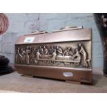 A bronze casket, decorated in relief depicting the Last Super, length 24.5cm.