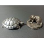 A hallmarked silver otter and a silver tortoise, marked Ag.