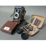 A 1962 vintage Rolleicord VB twin lens reflex camera, with leather case and accessories and spare