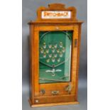 An early 20th century vintage Switchback penny arcade, with keys and ball bearings.