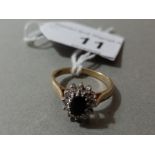 A hallmarked 9ct gold diamond and sapphire cluster ring, gross wt. 2.4g, size L.