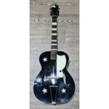 A vintage arch top guitar with soft case.