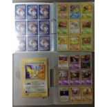 A collection of Pokemon cards including folder of 1990s cards, a plastic folder of Neo promotional