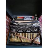 A Cardinal Grand piano accordion in case.