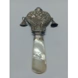 A silver and mother of pearl babies rattle, Birmingham, Adie & Lovekin Ltd, 1924.