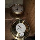 A Davies & Metcalfe Ltd. circular brass "maritime" clock together with an old brass bulkhead clock -