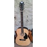 A Martin Smith W-100-N-PK steel strung acoustic guitar.