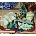 A tray of assorted jade and hard stone carvings.