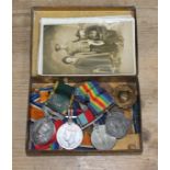 A tin of WWI and WWII medals comprising a George V Territorial Efficiency medal awarded to 3377105