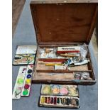 An artist's box with assorted vintage oils, pastels and watercolours.