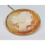 A yellow metal mounted shell cameo, length 32mm, gross wt. 6.7g.