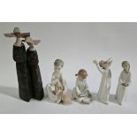 A collection of four Lladro figures and one Nao figure