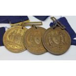 Three early 20th century good attendance medals.