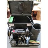 A cased Singer Featherweight 221k electric variable speed sewing machine with foot pedal, oil can,