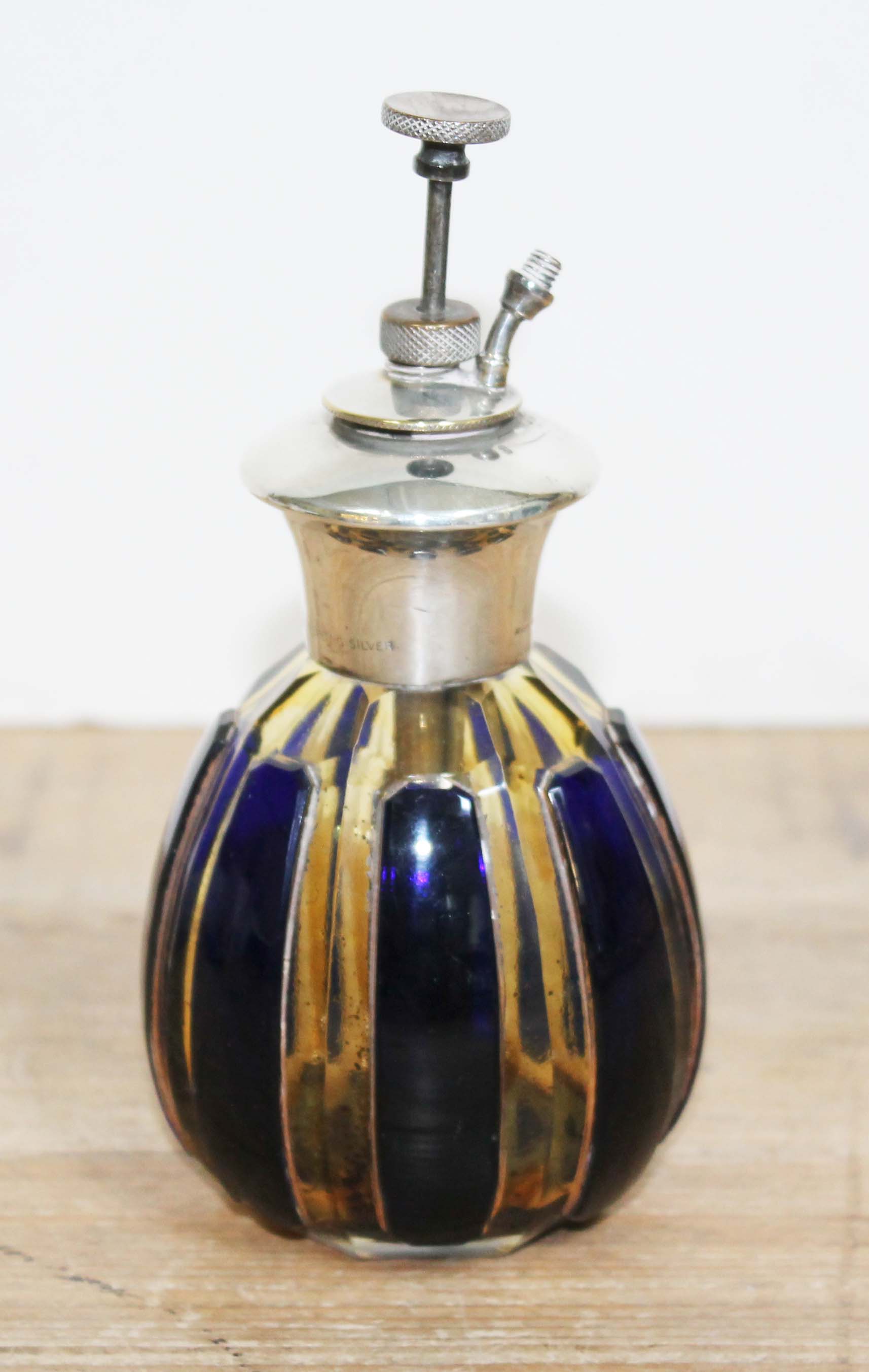 A blue flash glass scent atomiser marked 'Sterling Silver'.