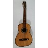 A parlour size Spanish guitar labelled 'Jose Alvares Dulcet'.