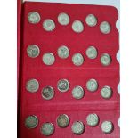 A coin library album containg 32 x sixpences (1911-1951), 1 x two shillings (1909), 2 x florins (