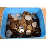 A tub of various world coins including some silver.