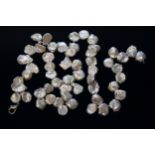 A single strand of cornflake or keshi pearls, length 57cm, gross wt. 36.7g.