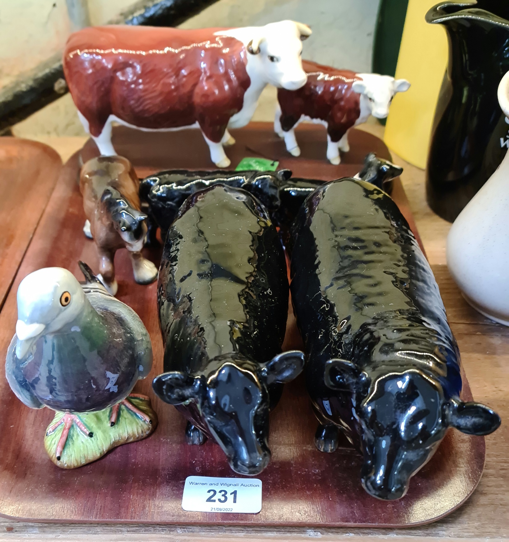 Assorted Beswick comprising two Aberdeen Angus cows, a cow and calf model, a sheep dog, a black calf