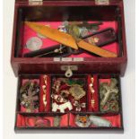 A leather jewellery box of assorted antique and vintage costume jewellery.